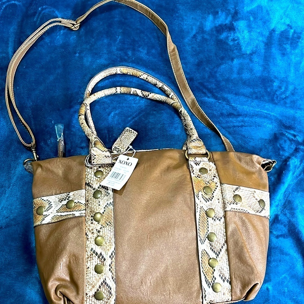 XOXO shoulder handbag tik tak vinyl color tan. Small scratch on the back.